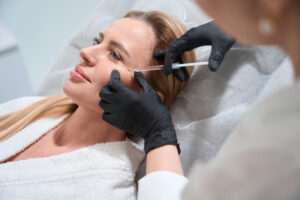 Sculptra is an injectable dermal filler designed to combat signs of aging by stimulating the body’s natural collagen production. The treatment involves injecting poly-L-lactic acid (PLLA), a biocompatible and biodegradable substance, into the skin to gradually restore volume and improve skin texture. Unlike other fillers that provide immediate results, Sculptra works over several months, providing subtle, natural-looking enhancements that can last up to two years. It is commonly used to treat deep wrinkles, folds, hollow areas, and for facial contouring in regions like the cheeks, temples, jawline, chest, and buttocks.